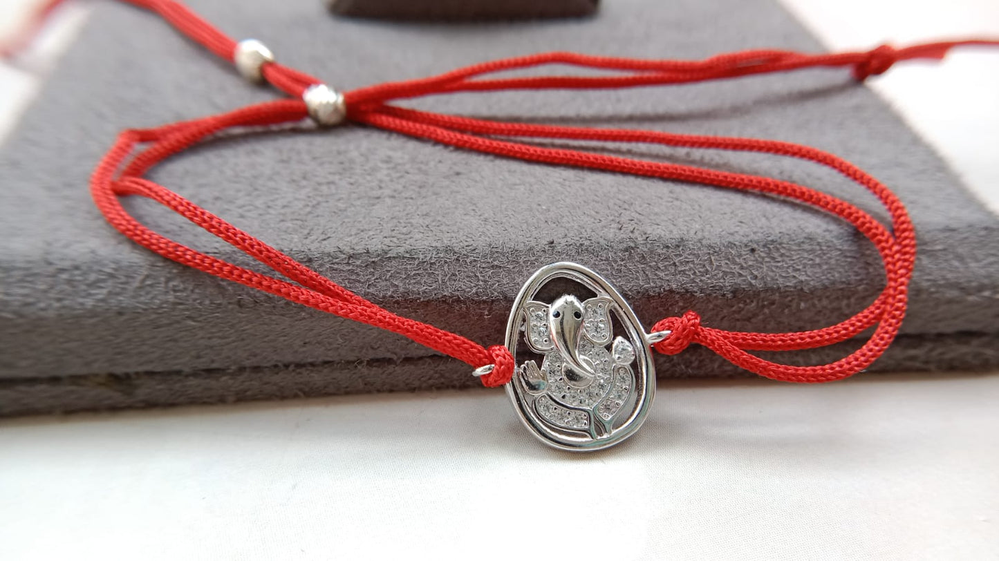 Silver Lord Ganesh Rakhi with Red Thread
