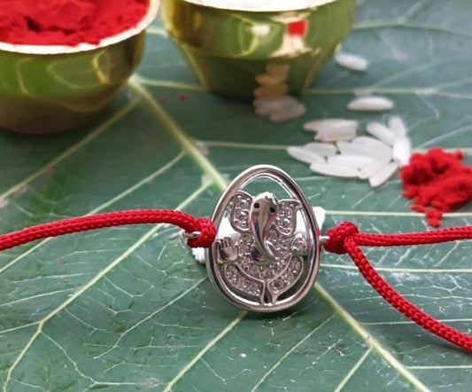 Silver Lord Ganesh Rakhi with Red Thread