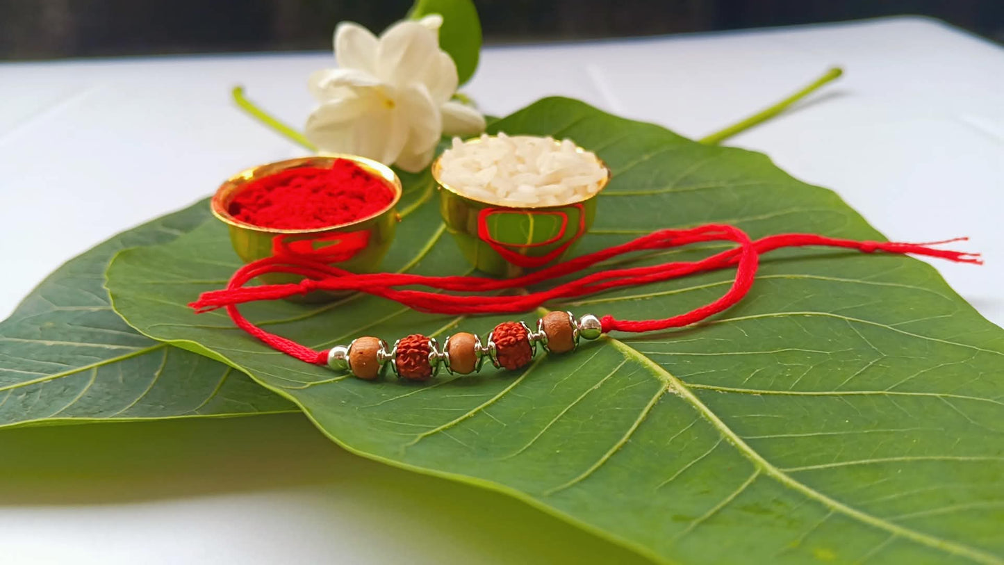Silver Rudraksh Rakhi with Red Thread - Shield of Love