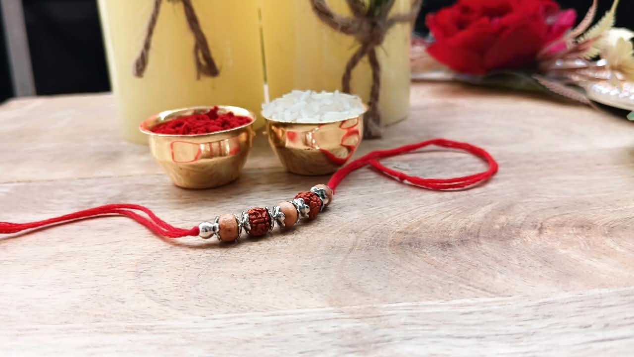 Silver Rudraksh Rakhi with Red Thread - Shield of Love