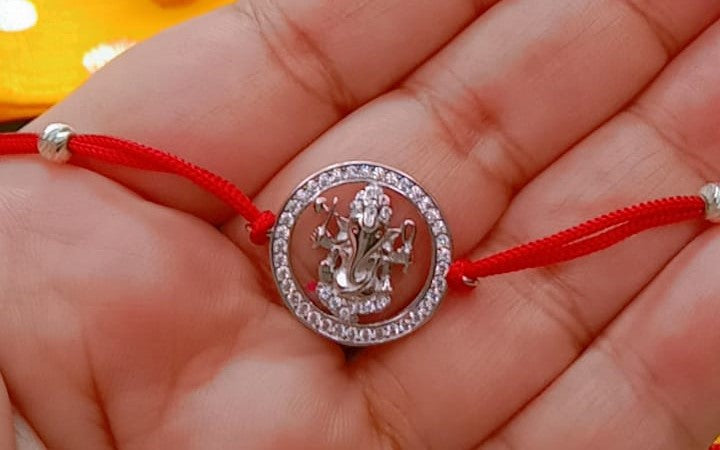 Silver Ganpati Rakhi with Red Thread