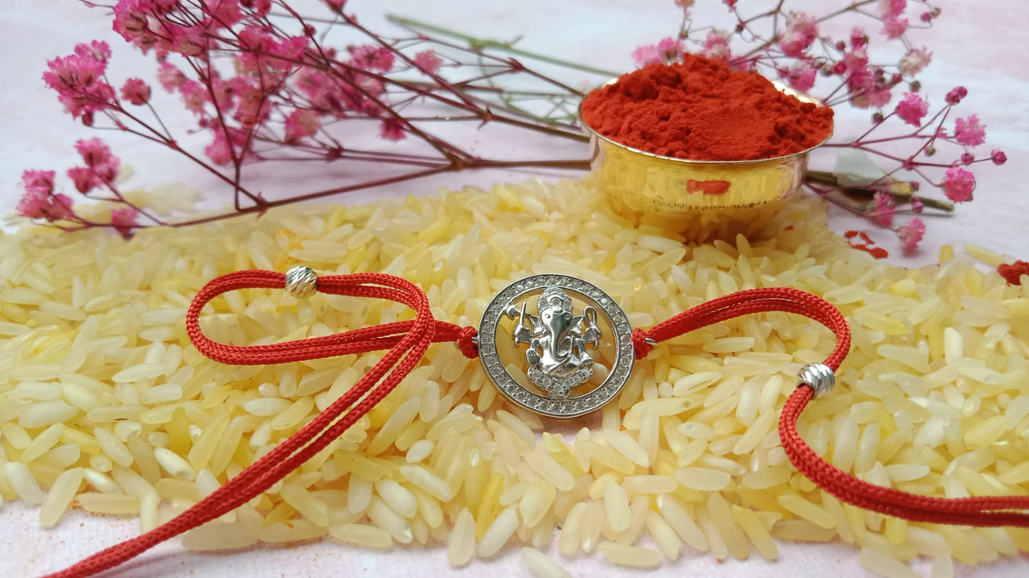 Silver Ganpati Rakhi with Red Thread