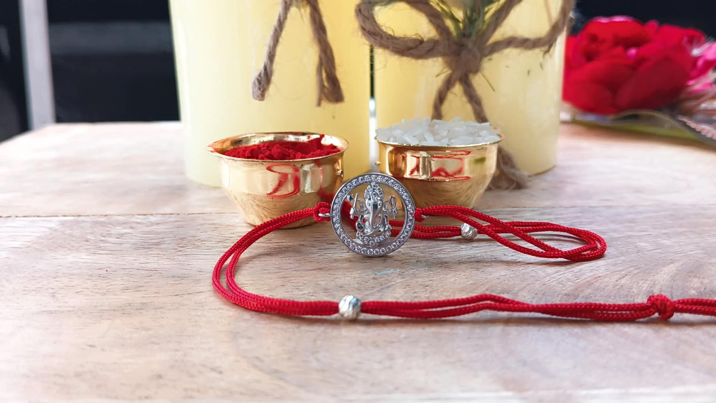 Silver Ganpati Rakhi with Red Thread