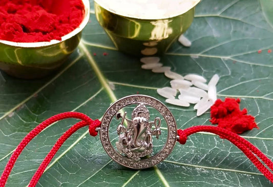 Silver Ganpati Rakhi with Red Thread