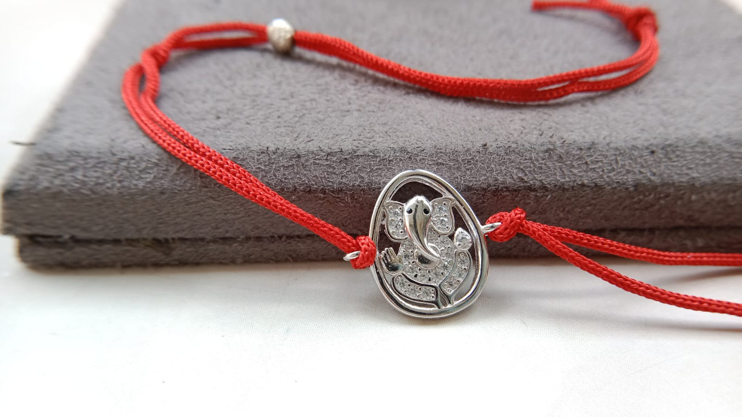 Silver Lord Ganesh Rakhi with Red Thread