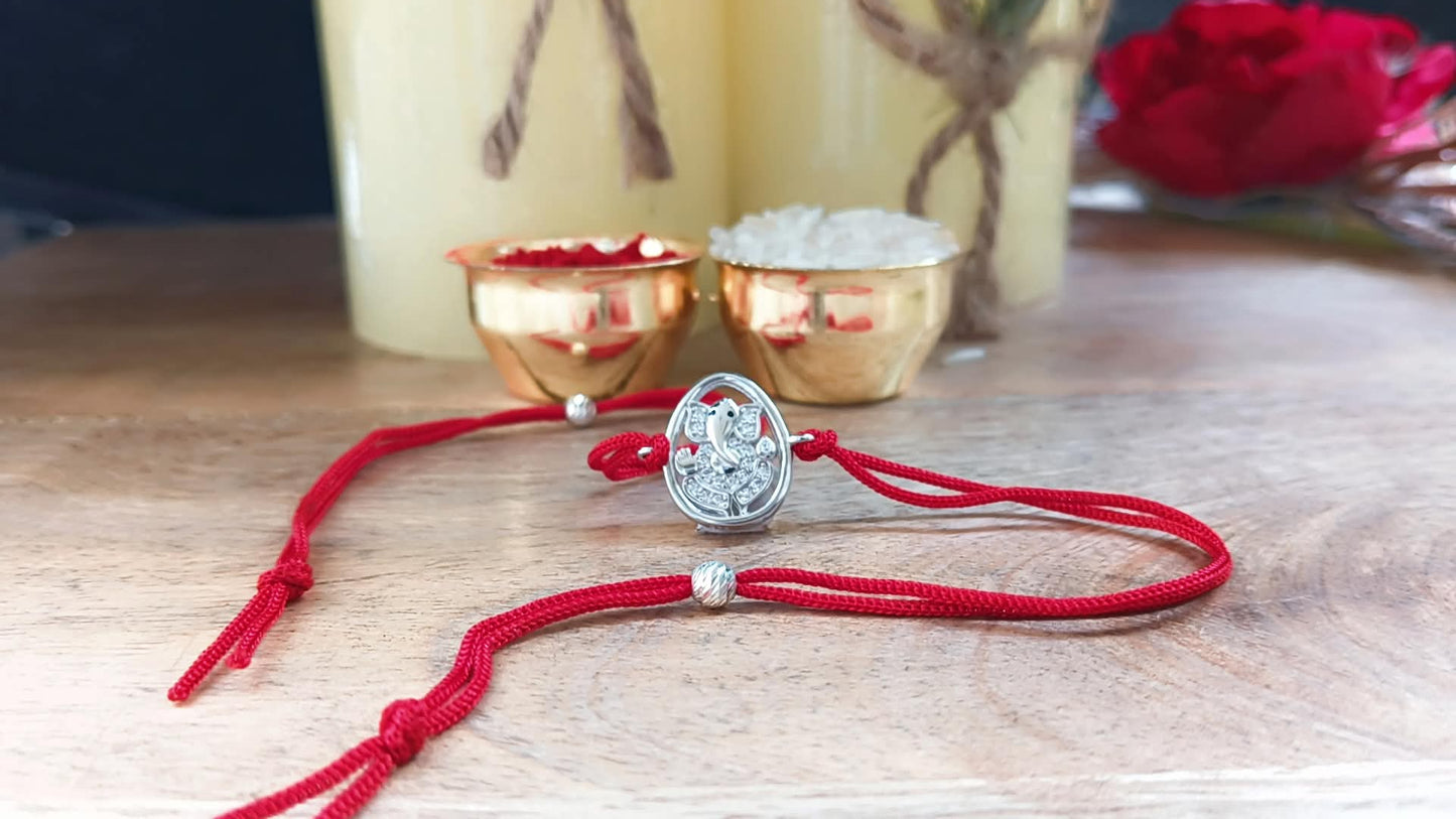 Silver Lord Ganesh Rakhi with Red Thread