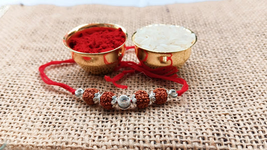 Silver Sacred Rudraksha Rakhi with Red Thread