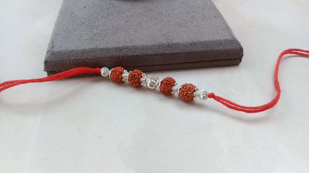 Silver Sacred Rudraksha Rakhi with Red Thread
