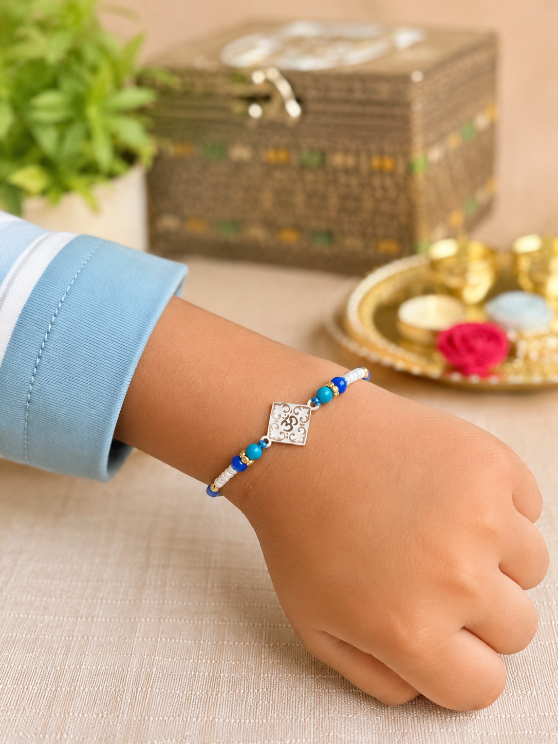 925 Silver Kids Rakhi with Om  (ॐ) Charm & Blue Beads