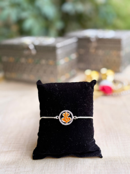 925 Silver Auspicious Ganesha ( ᬒᬁ ) Bracelet Rakhi with Saffron Enamel and adjustable Silver chain