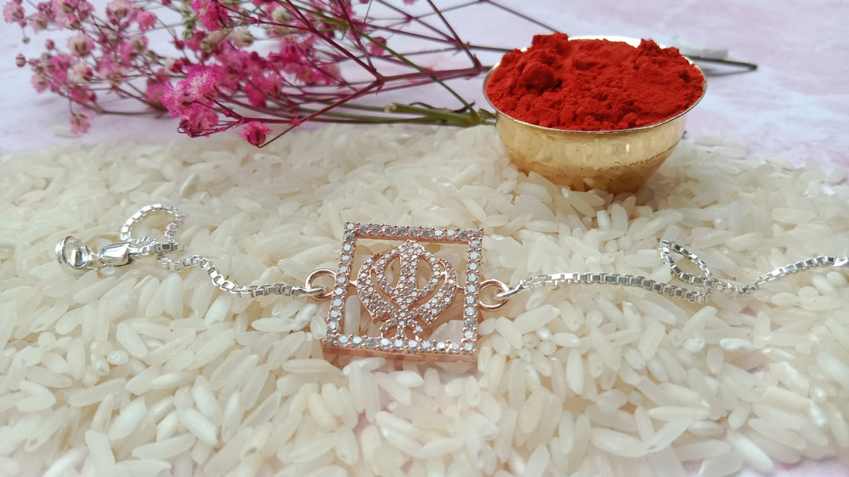925 Silver Sacred Khanda ( ☬ ) Bracelet Rakhi with Stone-Studded Rose Gold Finish and adjustable Silver chain