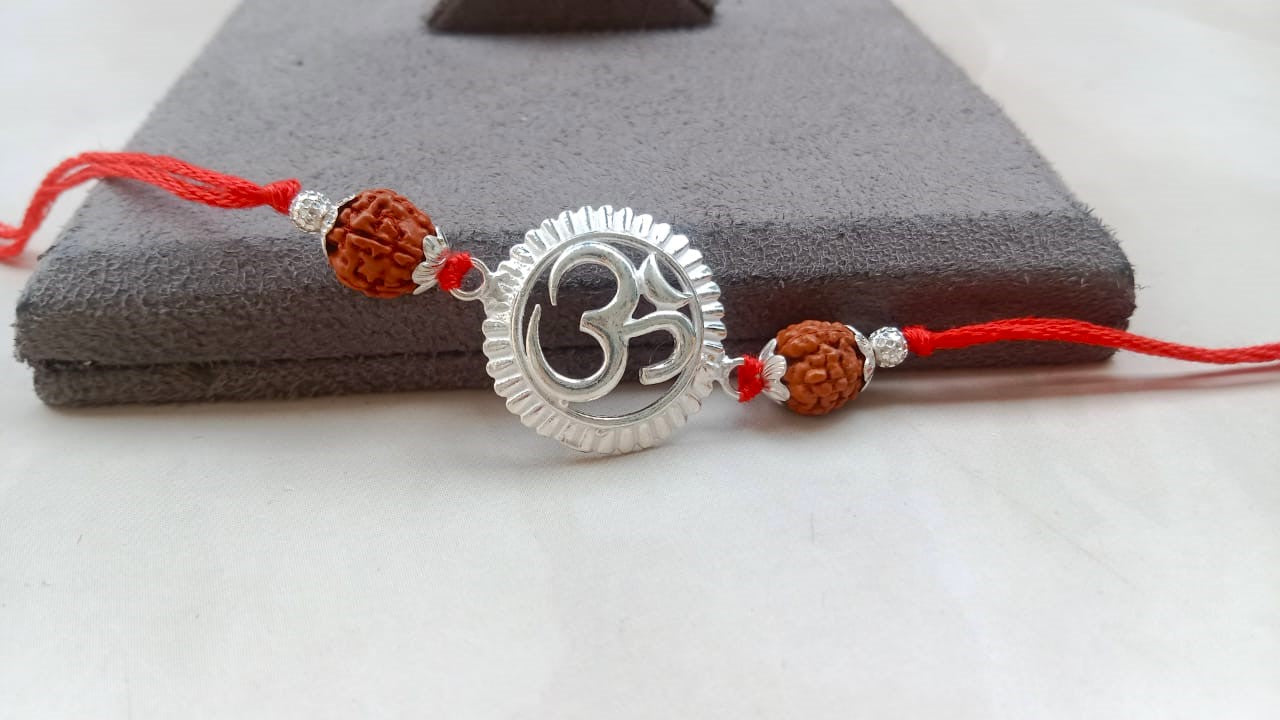 Silver Om Symbol Rudraksha Rakhi with Red Thread