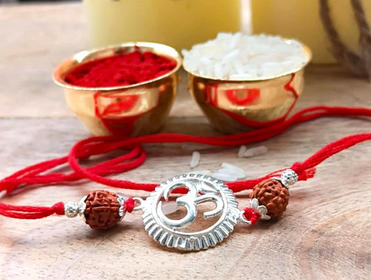 Silver Om Symbol Rudraksha Rakhi with Red Thread