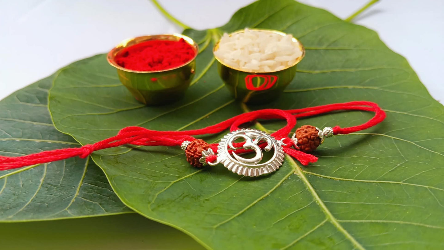 Silver Om Symbol Rudraksha Rakhi with Red Thread