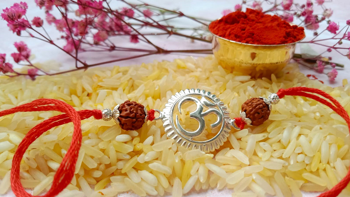 Silver Om Symbol Rudraksha Rakhi with Red Thread