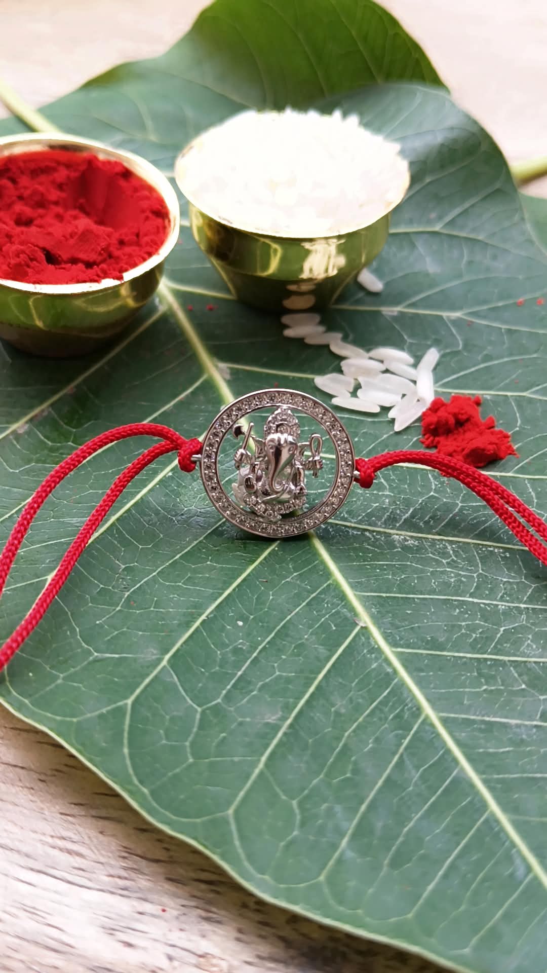 925 Silver Auspicious Ganesha ( ᬒᬁ ) Rakhi for Brother with Red Thread